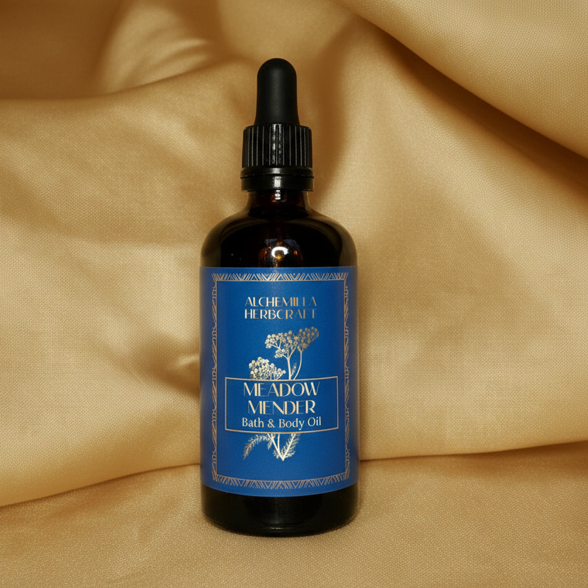Bottle of N. Adams Mender bath and body oil on a beige fabric background