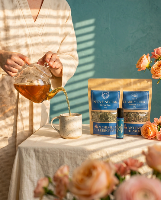 The Calm and Clarity self care ritual set on linen fabric with a steaming mug of tea.