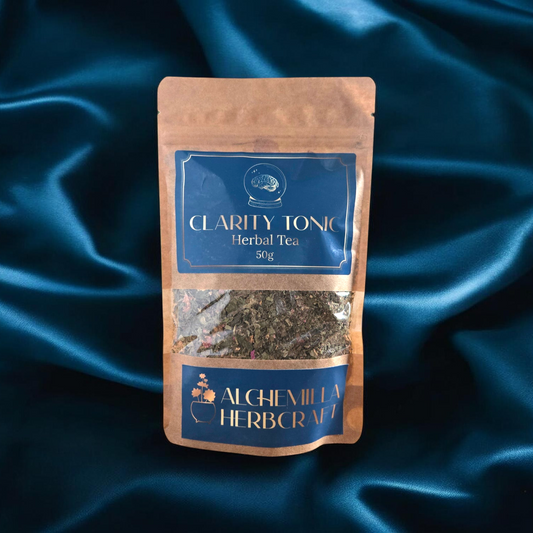 A package of herbal tea for focus on a blue fabric