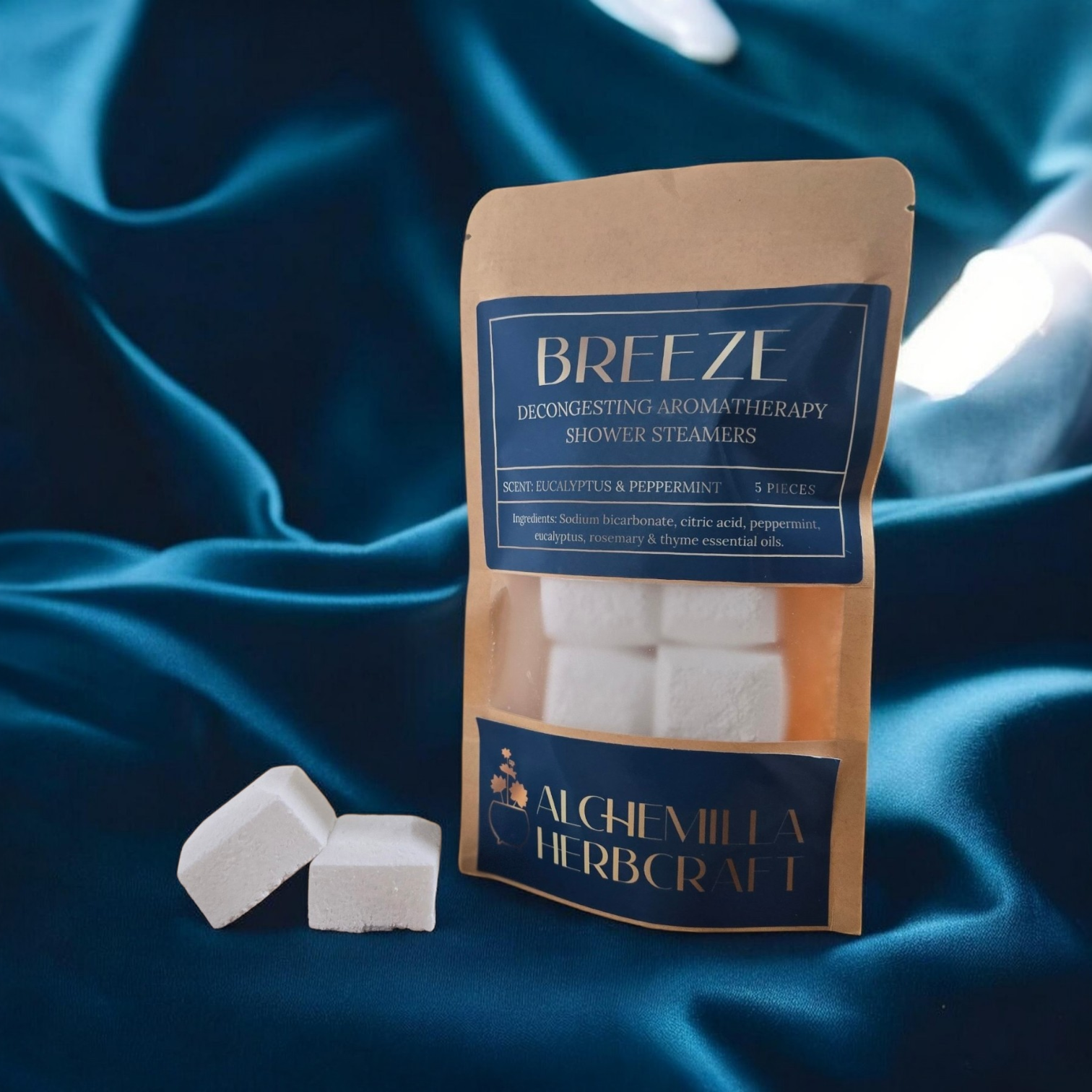 Eucalyptus and mint shower steamers on a teal fabric