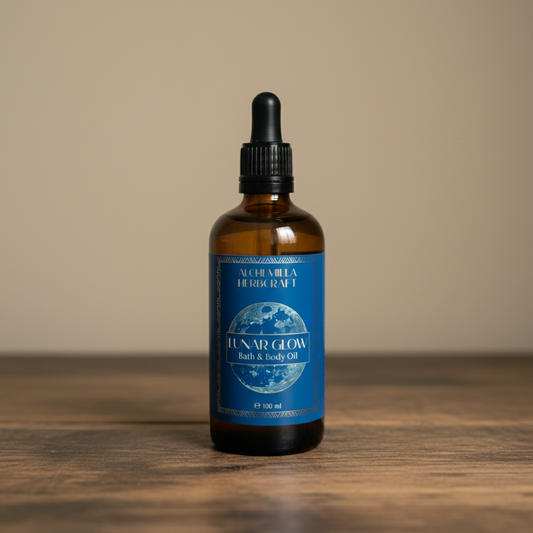 Bottle of Lunar Glow bath and body oil on a wooden surface with a dark background